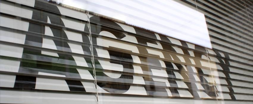 6P Marketing | black bold letters saying "agency" written on blinders | In-House Marketing Team or Hire an Agency Blog