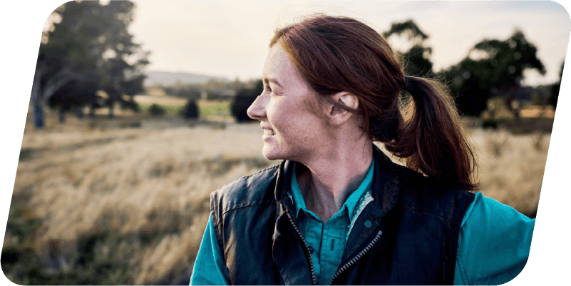 A woman looking out over farmlands